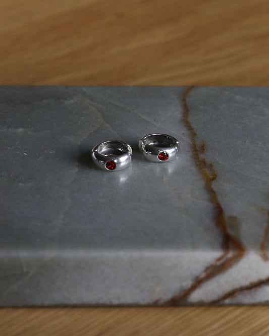 Silver Huggies With Red Cubic Zirconia